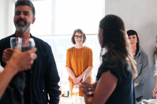 Hannah Wilson (left) and Peg White (right) of the Brown Bread team celebrate their B Corp certification. In the foreground is Stephen McCarthy of McCarthy Design