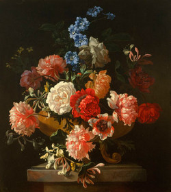 Roses, honeysuckle and other flowers in a sculpted vase