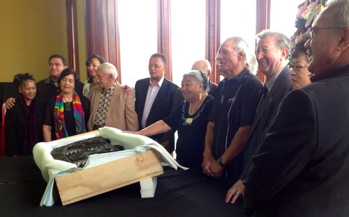 Te Arawa elders stand proudly behind their returned taonga.