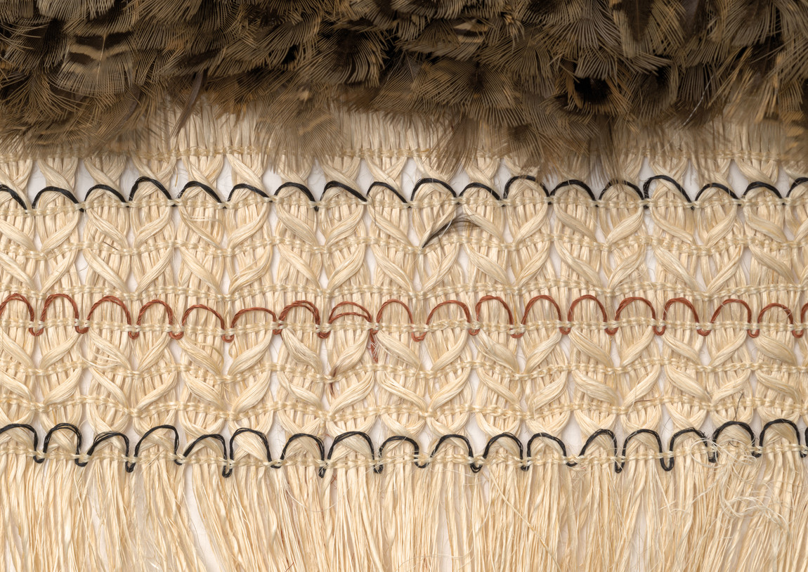 Te Aue Davis (Ngāti Maniapoto, Ngāti Uekaha) Te Aroha o Te Aue Davis 2010. Whito (muka),feathers from kiwi and weka. Collection of Ta Mark Solomon
