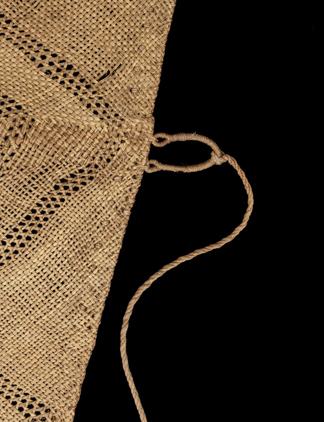 Makers unknown Te Rā [the sail] (detail) c. 1770–1800. Harakeke, kererū, kāhu and kākā feathers, dog skin. On loan from the Trustees of the British Museum. © The Whakaarahia anō te rā kaihau Te Rā Project. Photo: Cultural Heritage Imaging