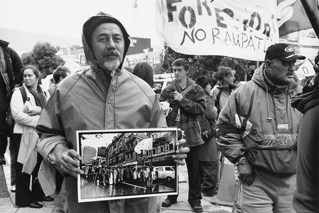 2004 Foreshore and Seabed March, Cyril Chapman holding photograph of himself leading the 1975 Māori Land March in Wellington